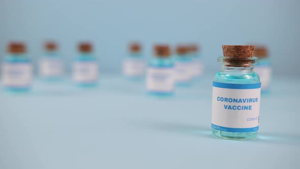 New Vaccine Pfizer Biontech Isolated on Blue Background alt