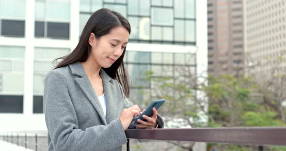 Business woman use of mobile phone for online alt