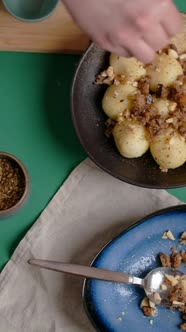 Vertical Flat Lay Video Chef Sprinkles Spices on Potato Dumplings