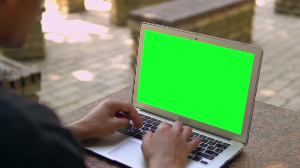 Back View Maly Entering Data on Compute alt