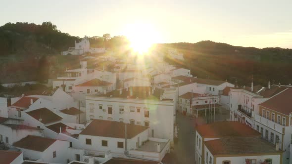 Aerial drone view of Alcoutim with sun behind it in Algarve, Portugal alt