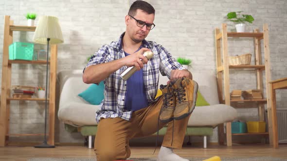 Man Cleans Shoes From Dirt Special Brush alt