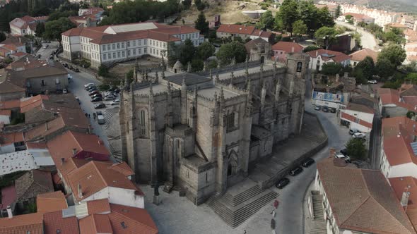 Aerial parallax view Guarda city Cathedral ancient Landmark, historic downtown - Portugal