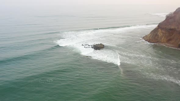 Powerful Waves Forming Breaking on the Shore and Splashing with White Foam alt