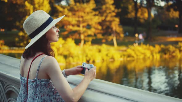 Young tourist with a retro camera, NYC alt
