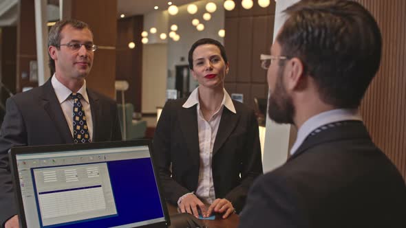 Business Visitors at Hotel Check-In alt