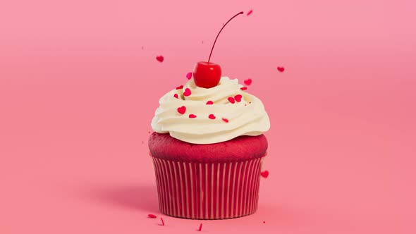 A cupcake with cream and cherry. Valentines' decorating. Heart-shaped sprinkles. alt
