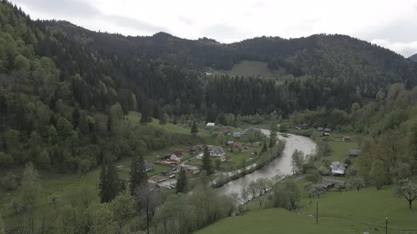 River in the Mountains. Slow Motion. Carpathians. Ukraine. Aerial. Gray, Flat alt