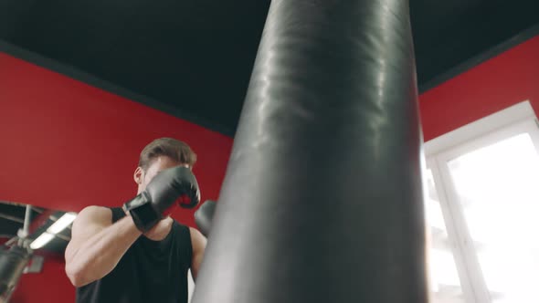 Kickboxer Man Making Strikes at Fight Training alt