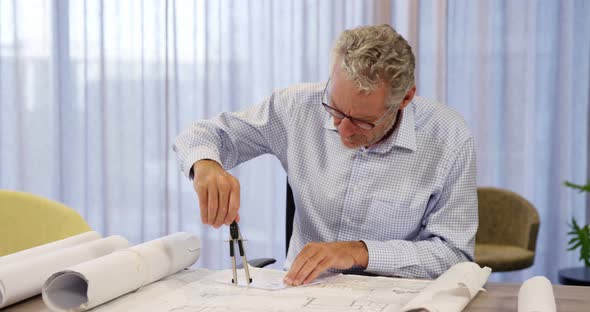 Architect working on blueprint alt