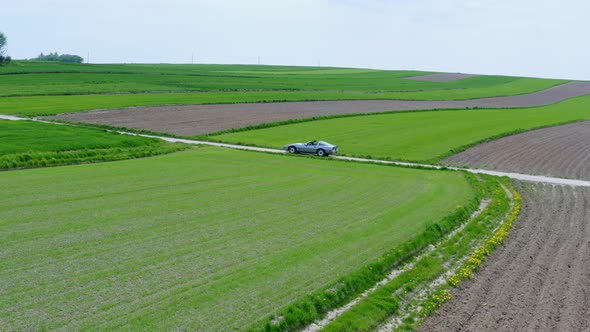 Convertible Car Parked On a Field