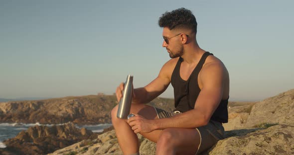 Tranquil man enjoying seascape in summer at sunset alt
