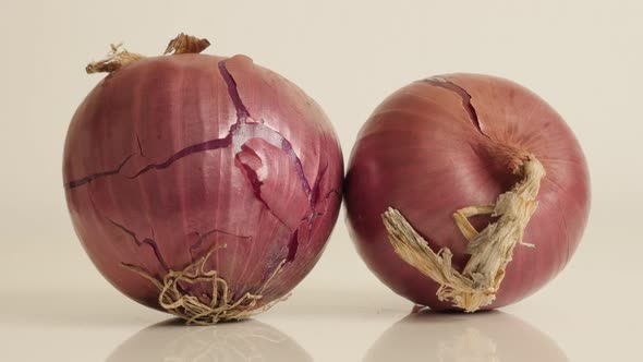 Close-up of  onion with red skin and white flesh  4K 2160p 30fps UltraHD tilting footage - Organic A alt