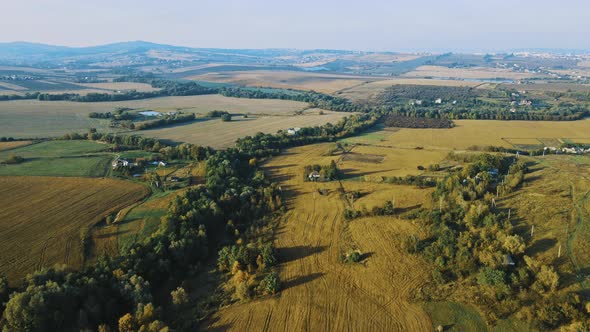 Flight over the fields behind the western Ukrainian village Aerial view