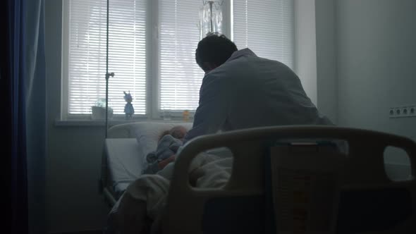 Doctor Examining Child Stethoscope in Hospital Ward alt