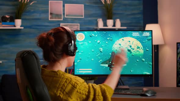 Pro Gamer Putting on Headset Testing New Space Shooter Video Game alt