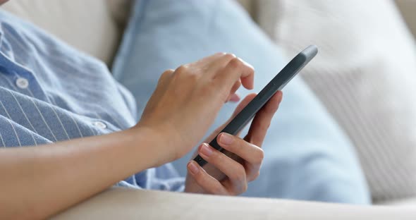 Close up of woman use of mobile phone alt