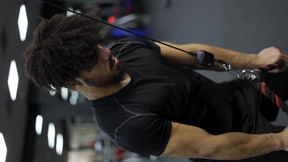 Young Man Exercising on Multistation at Gym Slow Motion alt