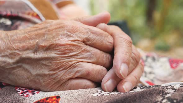 Painful Arms of Old Grandmother During Resting Outdoor alt