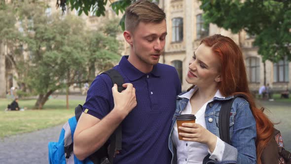Couple of Students Flirts on Campus alt