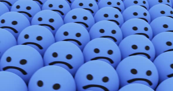 Smiling Emoticon in a Huge Array of Sad Emojis