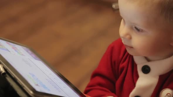 Child with a Tablet in His Hands the Child Falls Asleep Watching Cartoons alt