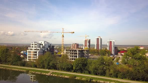 Aerial view of high residential apartment buildings under construction. Real estate development. alt