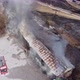Aerial View Of Firemen Calming The Fire In A Building 4K - VideoHive Item for Sale