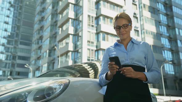 Businesswoman Checking Message on Cellphone, Success in Personal Life and Work alt