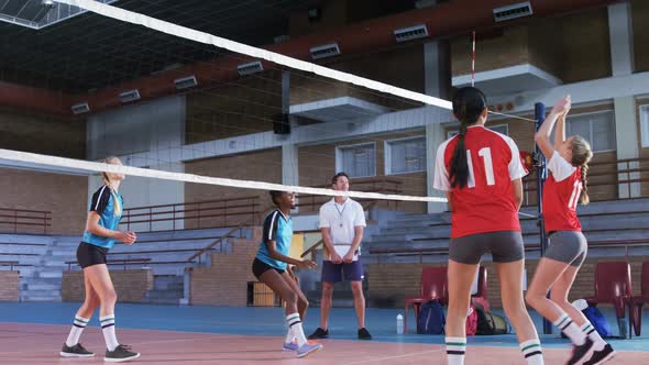 Female players playing volleyball in the court 4k alt