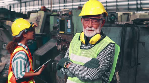 Senior Factory Worker or Engineer Close Up Portrait in Factory alt