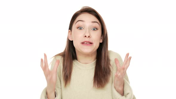 Studio Portrait of Happy Female Person Being Glad and Satisfied to Reach Goals Clenching Fists alt