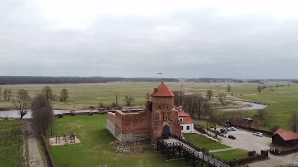 Aerial View of Brick Old Tower with Flag