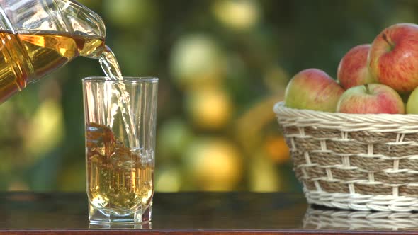 Apple juice and basket with apples