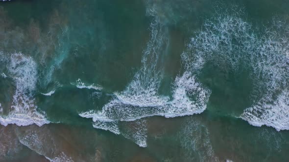 Aerial View A Big Wave Crashes Into The Shore At Karon Beach alt