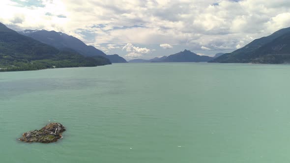 Ocean Dolly Of Small Island And Turquoise Water With Tropical Forest Background alt