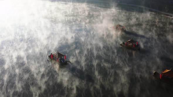 Aerial View of Sunrise with Fog Over Ban Rak Thai Chinese Village Near a Lake in Mae Hong Son alt