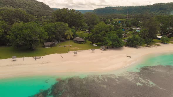 Port Orly sandy beach with palm trees, Espiritu Santo Island, Vanuatu