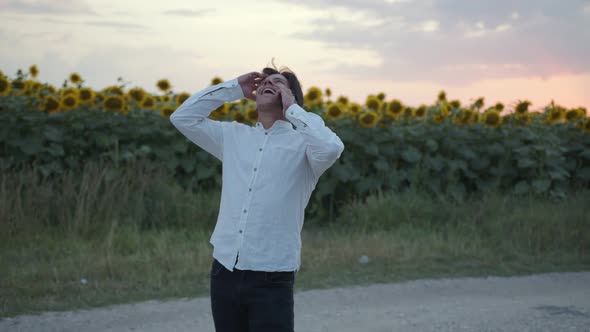 Glad Man Talks on His Phone Sunflower Field alt