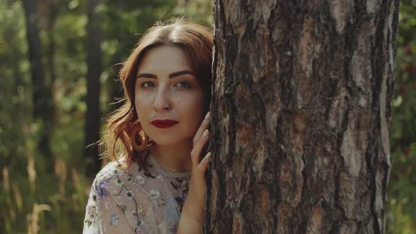 Portrait of an Attractive Woman with Closed Eyes and a Bouquet of Spikelets in Her Hands Near the alt