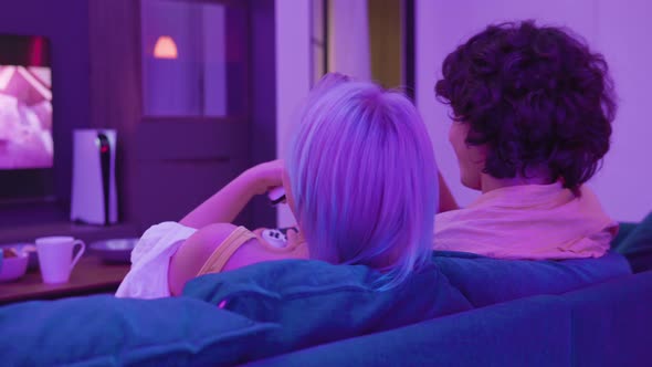 Happy Couple Sit Couch Playing Video Games Home alt