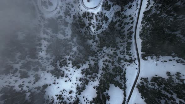 High angle aerial footage of winding road near Crater Lake, Oregon, USA alt