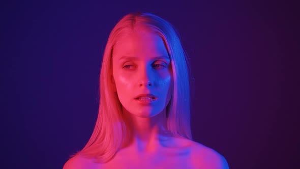 Sensual Young Woman in Neon Light alt