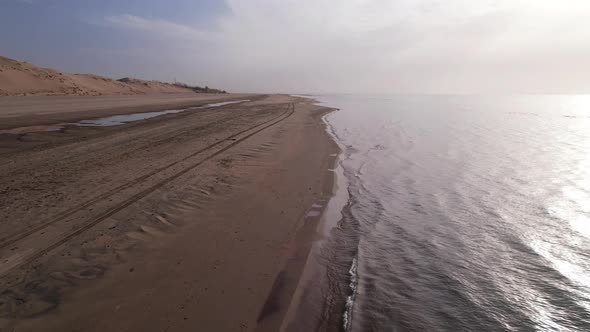 Dawn on the Sandy Beach of the Sea alt