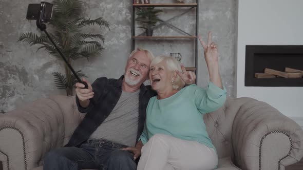 Happy Funny Mature Senior Couple Taking Selfie Looking at Smartphone, Cheerful Elder Old alt