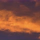 Golden Clouds at Sunset Floating Across Dramatic Violet and Purple Thunderclouds - VideoHive Item for Sale