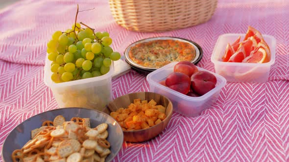 Food and Picnic Basket on Blanket on Beach alt