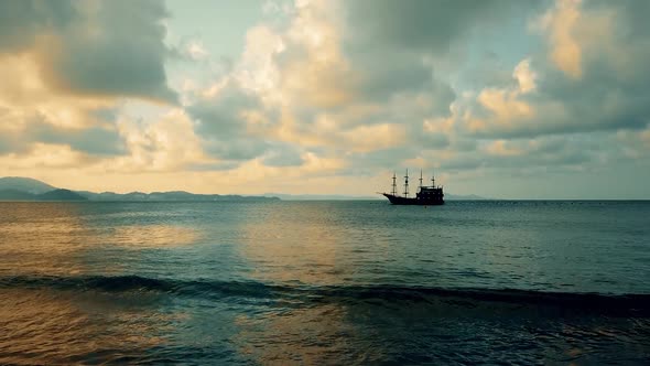 Old vessel on sea moving to new lands during the discovery of americas. Calm beach getting invaded b alt