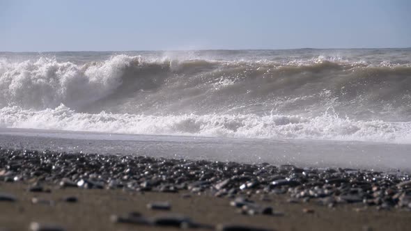 Storm on the Sea. Huge Waves Are Crashing and Spraying on the Beach alt