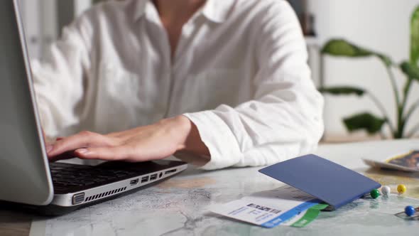 Travel Agency Agent Manager Working On A Portable Laptop Making Out A Trip For A Tourist Who Planned alt